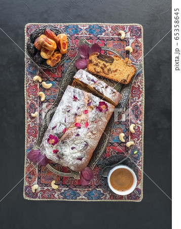 Honey and date cake on a black background 65358645