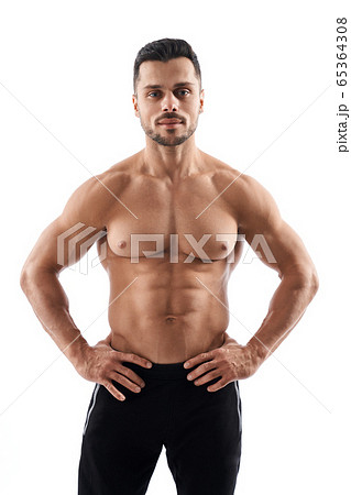 Shirtless muscular bodybuilder posing. 65364308