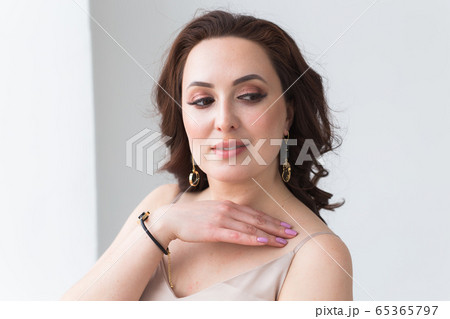 Close-up of beautiful woman wearing bracelet. Accessories, jewelry and bijouterie concept. 65365797