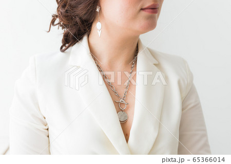 Close-up of woman wearing a Jewelry, bijouterie and accessories. Close-up of woman wearing a Jewelry, bijouterie and accessories. 65366014