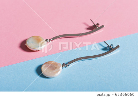 Top view of fashion jewelry and accessories on bright color background. Luxurious jewelry bijouterie and trendy concept. Top view of fashion jewelry and accessories on bright color background. Luxurious jewelry bijouterie and trendy concept. 65366060