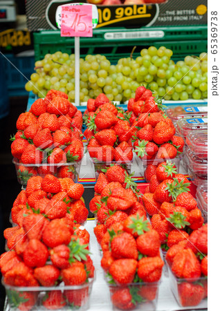 Sale juicy, fresh strawberries, blackberries in market Sale juicy, fresh strawberries, blackberries in market 65369738