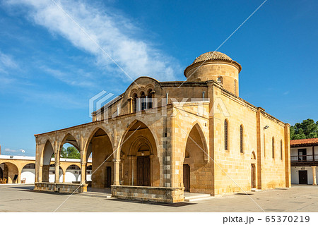 Square with Agios Mamas church with bell tower, 65370219