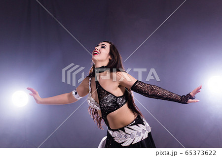 Belly dancer. Young attractive woman dancing...の写真素材 [65373622] - PIXTA