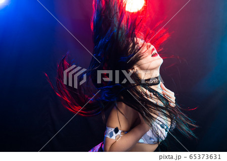 Portrait of a woman in oriental costume performing belly dance. Tribal fusion dance concept. 65373631