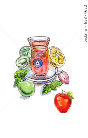 Turkish apple tea in traditional glass cup with fresh fruit and lemon balm 65374622