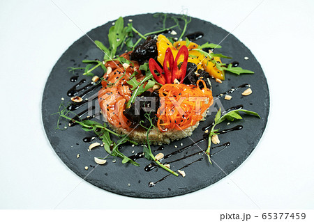 Hawaiian salmon fish poke bowl with rice, radish,cucumber, tomato, sesame seeds and seaweeds. Buddha bowl. Diet food 65377459