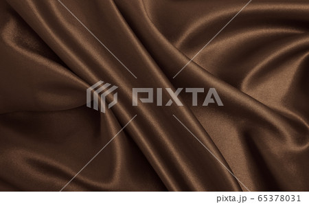 Smooth elegant brown silk or satin texture as 65378031
