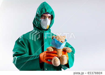 Man with teddy bear Coronavirus pandemic concept stock photo 65378804
