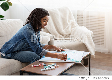 Quarantine Hobby. Relaxed Black Woman Drawing Painting By Numbers At Home Quarantine Hobby. Relaxed Black Woman Drawing Painting By Numbers At Home 65382205