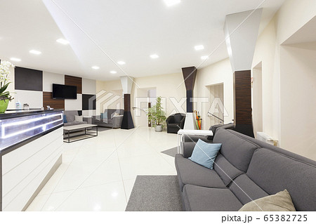 Entrance to the private dentistry, the waiting area and wall with big tv 65382725