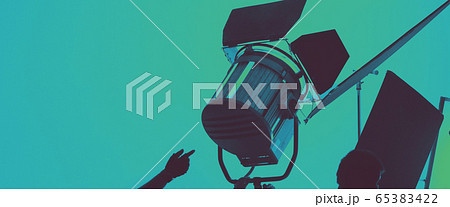 Flash light on tripod in studio production set up for professional photographer shooting photo or filming video and movie which use in entertainment and advertising industry 65383422