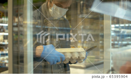 A man choosing food in the supermarket A man choosing food in the supermarket 65395904