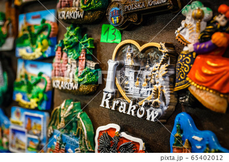 Colorful tourist souvenirs on a market in Krakow 65402012