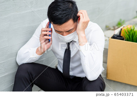 Asian man being fired 65403371