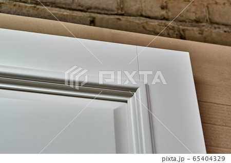 Joinery. White doors . Wood door manufacturing process. Furniture manufacture. 65404329