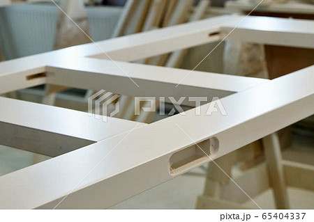Joinery. Painted door leafs in paint spray booth. Wood door manufacturing process. Joinery. Painted door leafs in paint spray booth. Wood door manufacturing process. 65404337