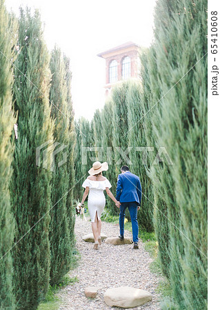 View from behind the bride in a white dress and 65410608