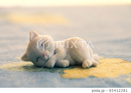 sleeping cat toy close up background copy space with film grain vintage effect sleeping cat toy close up background copy space with film grain vintage effect 65412281