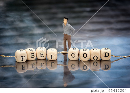 Miniature model of man and wooden cubes with feel Miniature model of man and wooden cubes with feel 65412294