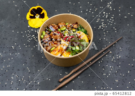 Poke bowl with chicken and vegetables on the white table. Poke bowl with chicken and vegetables on the white table. 65412812