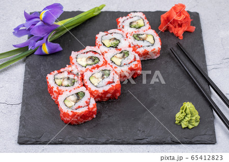 Group of fresh rolled sushi on bamboo sushi mat Stock Photo - Alamy