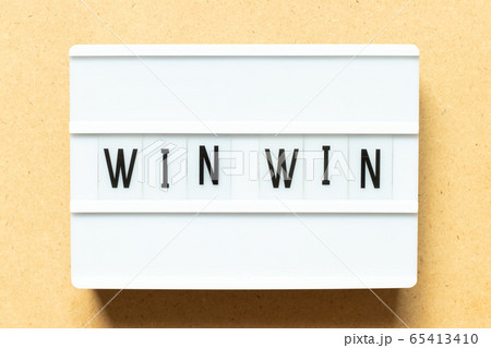 Lightbox with word win win on wood background 65413410
