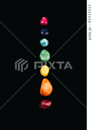 Chakra stones, crystals in a row on black background 65414313