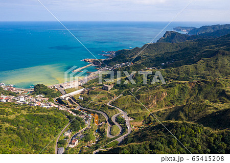 Drone view of Ruifang town and Yin and Yang Sea in New Taipei city 65415208