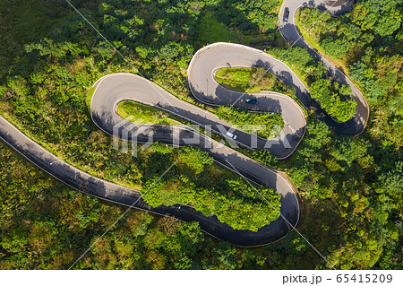 Drone view of winding road on mountain in Taiwan 65415209