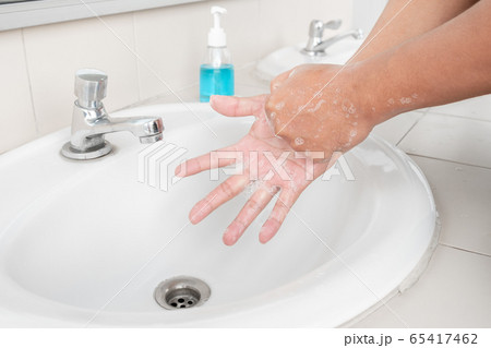 Men's hands wash their hands with soap clean hands in the tub with soap, personal hygiene 65417462