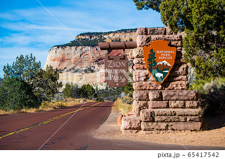 Zion National Park, Utah - November 10, 2017: View of the entrance sign in Zion National Park. Zion National Park, Utah - November 10, 2017: View of the entrance sign in Zion National Park. 65417542