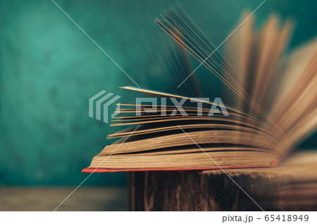 Beautiful abstract open book on a old wooden Beautiful abstract open book on a old wooden 65418949