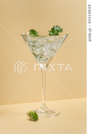 Fresh cocktail drink ice garnish green leaves Fresh cocktail drink ice garnish green leaves 65419639