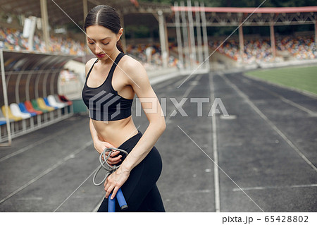 Sports girl training at the stadium Sports girl training at the stadium 65428802