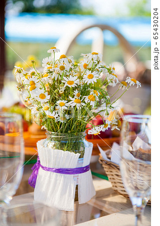 table set dishes and decorated with daisies table set dishes and decorated with daisies 65430204