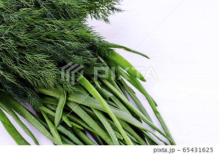 A bunch of fresh chives and dill. Healthy vegetarian food. Close-up. 65431625