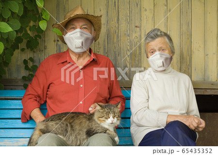 Older couple in protective mask outdoors 65435352