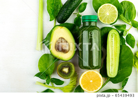 Beautifully laid out fresh green vegetables and a 65439493