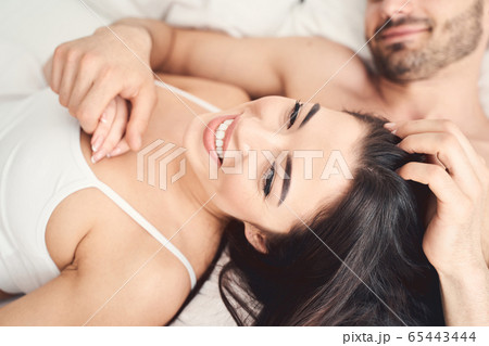 Happy young wife and her pleased spouse 65443444