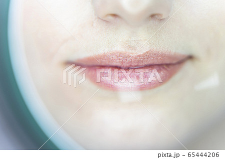 Procedure of facial skin examination in a beauty salon 65444206