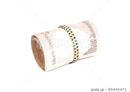 Roll of Indian rupees isolated on white 65445471