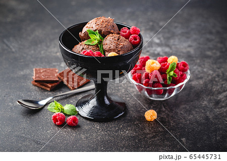 Three brown chocolate ice cream balls Three brown chocolate ice cream balls 65445731