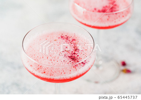 Pink Raspberry Cocktail in drink glass 65445737