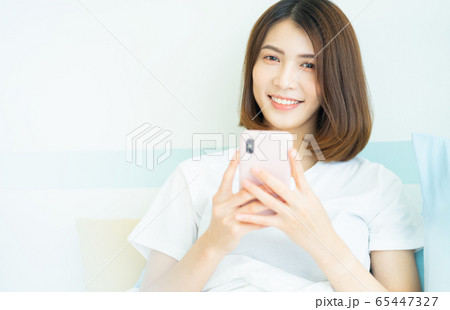 A woman at home A woman at home 65447327