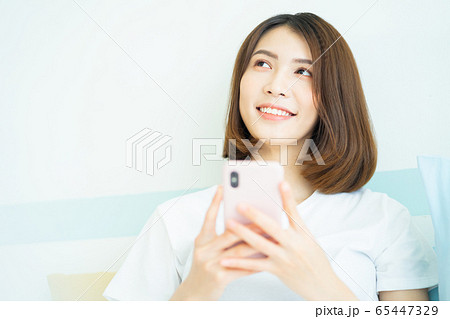 A woman at home A woman at home 65447329