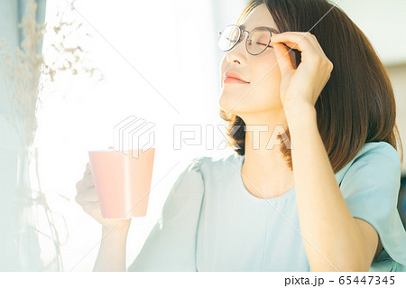 A woman at home A woman at home 65447345