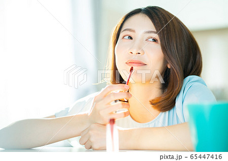 A beautiful woman at home 65447416