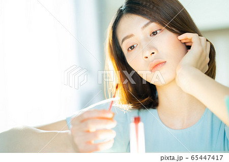 A beautiful woman at home A beautiful woman at home 65447417