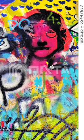 Detail of the famous John Lennon's wall with graffiti in Prague Detail of the famous John Lennon's wall with graffiti in Prague 65447657